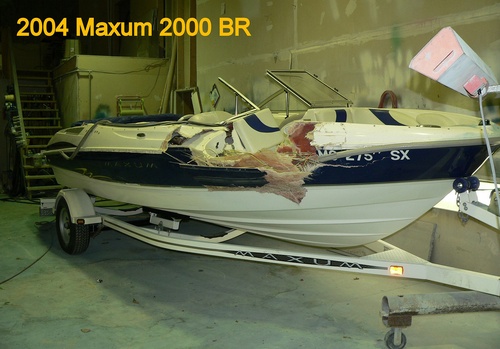 A restored fiberglass runabout at a Northern Michigan boatyard